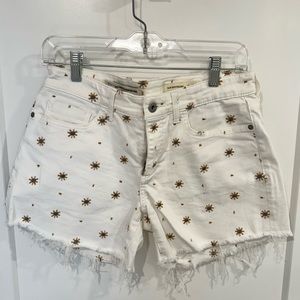 Anthropologie White Jean Shorts with turquoise and yellow “flower” stitching